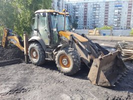 Услуги спецтехники для разравнивания грунта и насыпи стоимость услуг и где заказать - Барнаул
